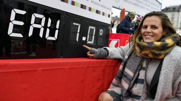 Former French swimmer Laure Manaudou poses with a board showing the temperature of Lake Geneva. (Fabrice Coffrini/AFP) Former French swimmer Laure Manaudou poses with a board showing the temperature of Lake Geneva. (Fabrice Coffrini/AFP)