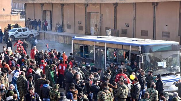 Syrians who were evacuated from Fuaa and Kafraya,two Shiite villages under rebel-siege on the northern outskirts of Idlib are welcomed by pro-government forces as they arrive in Jibrin on the eastern outskirts of Aleppo on December 19, 2016. (AFP Photo) Syrians who were evacuated from Fuaa and Kafraya,two Shiite villages under rebel-siege on the northern outskirts of Idlib are welcomed by pro-government forces as they arrive in Jibrin on the eastern outskirts of Aleppo on December 19, 2016. (AFP Photo)