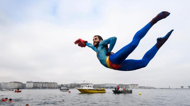 A swimmer disguised as Superman dives into the lake during the 78th "Coupe de Noel" (Christmas cup) swimming race in the Lake Geneva on December 18, 2016 in Geneva. (AFP) A swimmer disguised as Superman dives into the lake during the 78th "Coupe de Noel" (Christmas cup) swimming race in the Lake Geneva on December 18, 2016 in Geneva. (AFP)