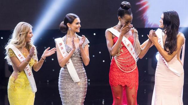 Miss Kenya Evelyn Njambi Thungu (in red) reacts after being named a finalist during the grand final of the Miss World 2016 pageant at the MGM National Harbor. (Zach Gibson/AFP)