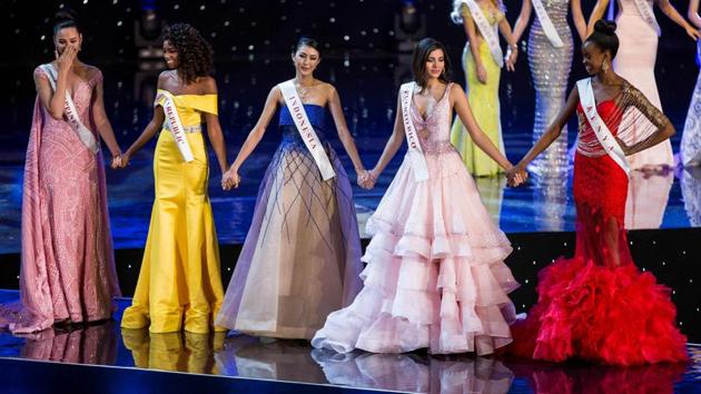 (L-R): Finalists Miss Philippines Catriona Elisa Gray, Miss Dominican Republic Yaritza Miguelina Reyes Ramirez, Miss Indonesia Natasha Mannuela, Miss Puerto Rico Stephanie Del Valle, and Miss Kenya Evelyn Njambi Thungu wait for the results of the pageant. (Zach Gibson/AFP)