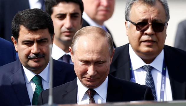 Russian Ambassador to Turkey Andrei Karlov (R) accompanies Russian President Vladimir Putin, who disembarks from the Presidential aircraft at Ataturk airport in Istanbul, Turkey, on October 10.(REUTERS File) Russian Ambassador to Turkey Andrei Karlov (R) accompanies Russian President Vladimir Putin, who disembarks from the Presidential aircraft at Ataturk airport in Istanbul, Turkey, on October 10.(REUTERS File)
