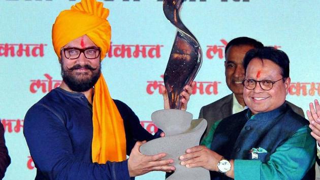 Lokmat Group chairman Vijay Darda felicitates Aamir Khan during a function in Kolhapur. (PTI)