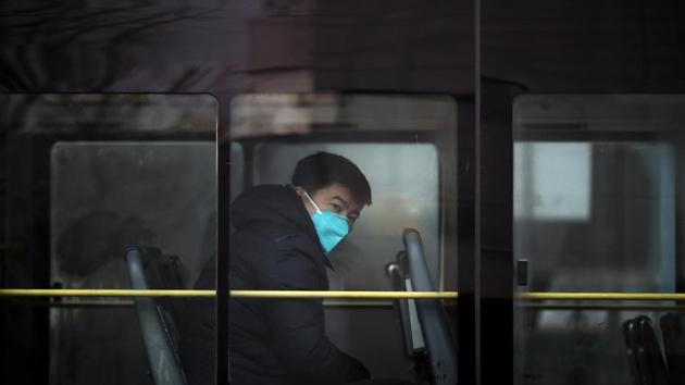 A man travels in a bus wearing a mask in Beijing. China’s long-standing air pollution is blamed on its reliance on coal and emissions from older cars. (AP photo) A man travels in a bus wearing a mask in Beijing. China’s long-standing air pollution is blamed on its reliance on coal and emissions from older cars. (AP photo)