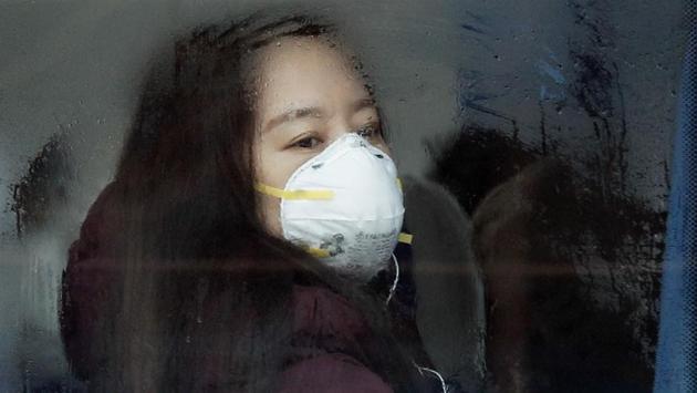 A woman wears a mask for protection in Beijing. (AP photo) A woman wears a mask for protection in Beijing. (AP photo)