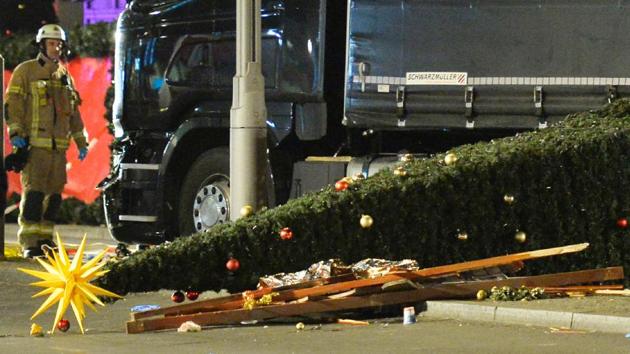 A Christmas tree lies on the ground after a truck rammed into a market at Gedächniskirche church in Berlin, killing at least 12 and wounding over 50 people, on December 19. (AFP Photo)