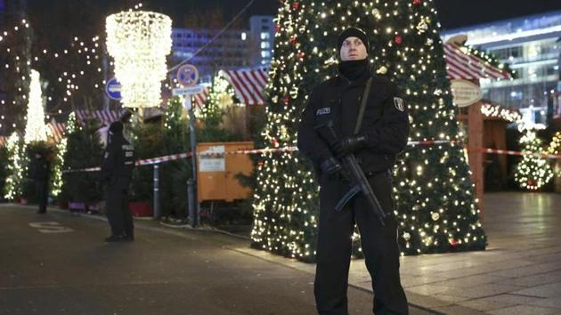 German police officers secure the site of an accident with a truck at a Christmas market on Breitscheidplatz square near the fashionable Kurfuerstendamm avenue in the west of Berlin, Germany, December 19. (REUTERS)