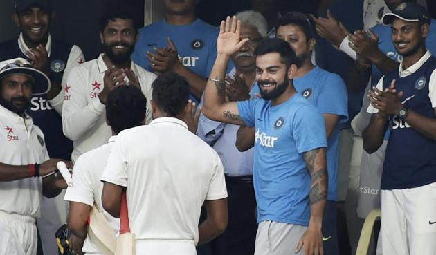 Karun Nair being greeted by skipper Virat Kohli and teammates after he scored unbeaten 303 runs against England in the Chennai Test.(PTI)