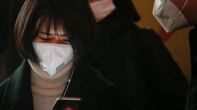 A woman waits for a bus on an extremely polluted day in Langfang, Hebei province. (Reuters photo) A woman waits for a bus on an extremely polluted day in Langfang, Hebei province. (Reuters photo)