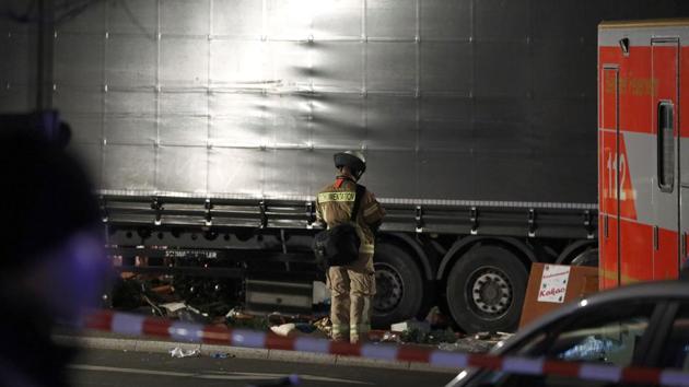 An official stands beside a truck at a Christmas market in Berlin, Germany. The truck ploughed into the crowded Christmas market in the German capital, killing at least nine people.(REUTERS)