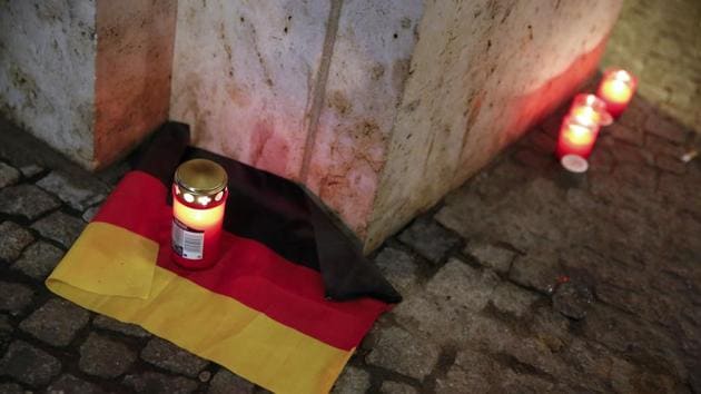 A candle is burning on a German national flag near the site where a truck ploughed through a crowd at a Berlin Christmas market on Breitscheidplatz square near the fashionable Kurfuerstendamm avenue in the west of Berlin, Germany, December 20, 2016 (REUTERS Photo) A candle is burning on a German national flag near the site where a truck ploughed through a crowd at a Berlin Christmas market on Breitscheidplatz square near the fashionable Kurfuerstendamm avenue in the west of Berlin, Germany, December 20, 2016 (REUTERS Photo)