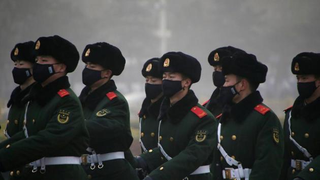 Paramilitary police officers wearing masks on patrol at Tiananmen Square in Beijing. (Reuters photo) Paramilitary police officers wearing masks on patrol at Tiananmen Square in Beijing. (Reuters photo)
