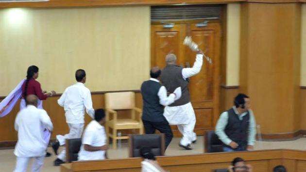 Video Grab of TMC MLA Sudip Roy Barman running away with Speaker's mace during the last day of the winter session. Video Grab of TMC MLA Sudip Roy Barman running away with Speaker's mace during the last day of the winter session.