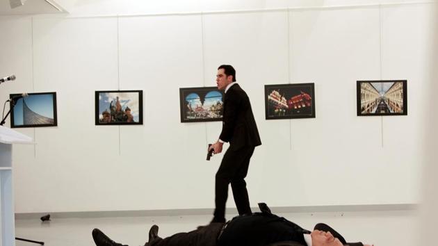 Russian ambassador to Turkey Andrei Karlov lies on the ground after he was shot by Mevlut Mert Altintas at an art gallery in Ankara.(REUTERS)