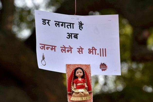 A placard with a doll hangs from the branch of a tree during a programme to mark the anniversary of Dec 16 gang rape case in New Delhi. (PTI File Photo) A placard with a doll hangs from the branch of a tree during a programme to mark the anniversary of Dec 16 gang rape case in New Delhi. (PTI File Photo)