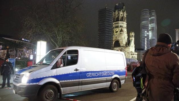 A hearse of the forensic medicine leaves the site where a truck ploughed through a crowd at a Christmas market on Breitscheidplatz square in Berlin.(Reuters Photo)