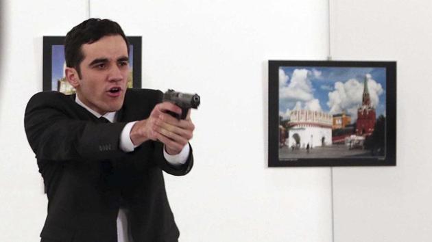 A gunman points his gun at those at an art gallery after shooting dead Russian ambassador to Turkey, Andrei Karlov, in Ankara, Turkey, on December 19, 2016. (AP Photo) A gunman points his gun at those at an art gallery after shooting dead Russian ambassador to Turkey, Andrei Karlov, in Ankara, Turkey, on December 19, 2016. (AP Photo)