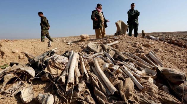 View of a mass grave in the town of Sinjar after it was recaptured by the Iraqi forces from ISIS. (Agency File Photo) View of a mass grave in the town of Sinjar after it was recaptured by the Iraqi forces from ISIS. (Agency File Photo)