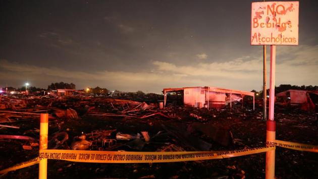 A massive explosion gutted Mexico’s biggest fireworks market, killing at least 29 people and injuring 70. The conflagration, in the suburb of Tultepec, set off a quickfire series of multicoloured blasts and a vast cloud of smoke yesterday that hung over Mexico City. (Edgard Garrido/REUTERS)