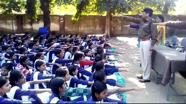 Girls students being administered oath that they would study till 18 years,under an initiative taken by Jhabua police. (HT photo) Girls students being administered oath that they would study till 18 years,under an initiative taken by Jhabua police. (HT photo)