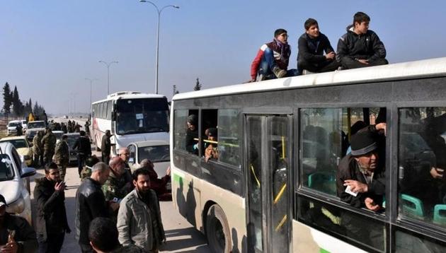 People who fled the Shi'ite Muslim villages of al-Foua and Kefraya arrive in government controlled Jibreen area in Aleppo, Syria in this handout picture provided by SANA on December 19, 2016. (Reuters) People who fled the Shi'ite Muslim villages of al-Foua and Kefraya arrive in government controlled Jibreen area in Aleppo, Syria in this handout picture provided by SANA on December 19, 2016. (Reuters)