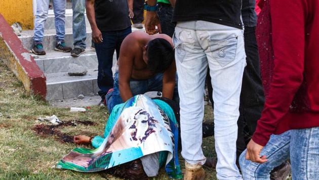A victim of a blast in a fireworks market, flattened by a huge blast. The market was packed at the time with customers buying pyrotechnics for traditional end-of-year festivities. (Israel Gutiérrez/AFP)