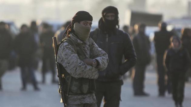Armed Syrian fighters evacuated from the embattled Syrian city of Aleppo during the ceasefire arrive at a refugee camp in Rashidin, near Idlib, Syria on December 20. (AP Photo) Armed Syrian fighters evacuated from the embattled Syrian city of Aleppo during the ceasefire arrive at a refugee camp in Rashidin, near Idlib, Syria on December 20. (AP Photo)