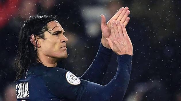 Paris Saint Germain 's forward Edinson Cavani celebrates after scoring a penalty against FC Lorient. (AFP) Paris Saint Germain 's forward Edinson Cavani celebrates after scoring a penalty against FC Lorient. (AFP)