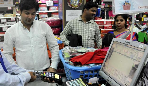 People using swipe machines in Indore. The sale of machines has increased in the city after demonetisation. (Arun Mondhe/HT photo) People using swipe machines in Indore. The sale of machines has increased in the city after demonetisation. (Arun Mondhe/HT photo)