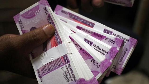 Parasmal Lodha was nabbed by the income tax department and Enforcement Directorate officials on Thursday for converting Rs25 crore in scrapped banknotes to the new currency.(Reuters file photo) Parasmal Lodha was nabbed by the income tax department and Enforcement Directorate officials on Thursday for converting Rs25 crore in scrapped banknotes to the new currency.(Reuters file photo)