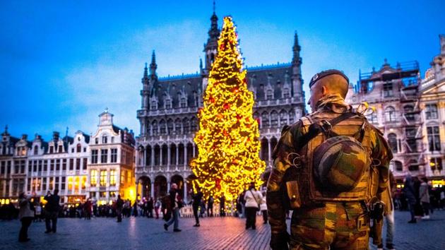 A serviceman patrols the Grand-Place (Groote Markt) during the ‘winter wonders’ Christmas market in Brussels. The 16th edition of the Christmas market is open till January 1. Security was beefed up across Europe after a lorry ploughed through a market in Berlin on December 19. (AFP photo)