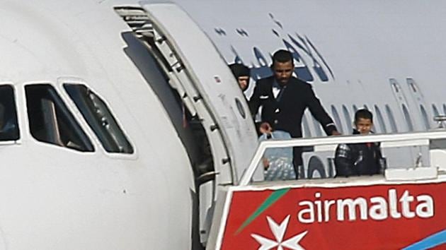 People disembark from a hijacked Libyan Afriqiyah Airways Airbus A320 on the runway at Malta Airport.(REUTERS) People disembark from a hijacked Libyan Afriqiyah Airways Airbus A320 on the runway at Malta Airport.(REUTERS)