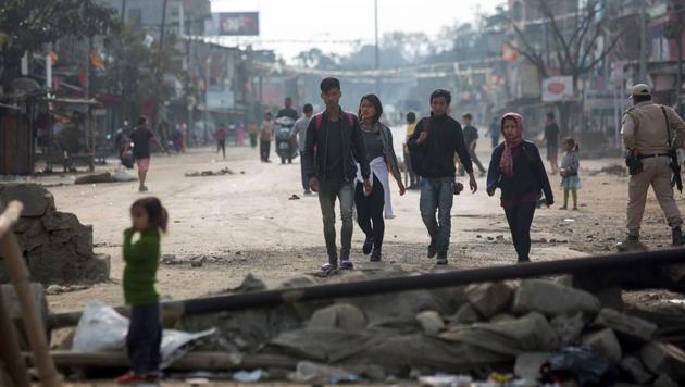 People walk past temporary roadblocks on the outskirts of Imphal on December 20, 2016, during an ongoing economic blockade led by Naga militant groups in the north-eastern Indian state of Manipur.(AFP Photo) People walk past temporary roadblocks on the outskirts of Imphal on December 20, 2016, during an ongoing economic blockade led by Naga militant groups in the north-eastern Indian state of Manipur.(AFP Photo)