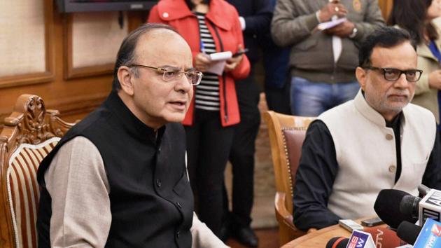 Union finance minister Arun Jaitley with revenue secretary Hasmukh Adhia addressing a press conference in New Delhi.(PTI Photo)