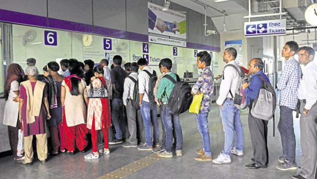 Passengers wait in queue to buy tickets at the Violet line's Escorts Mujesar metro station in New Delhi.(Saumya Khandelwal/HT File Photo)
