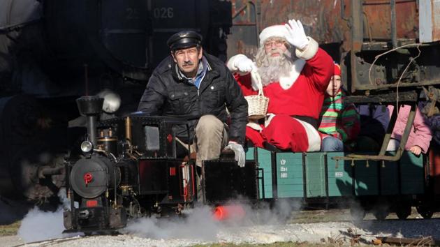 A man dressed as Santa Claus waves from a small train in a railway museum in Ljubljana, Slovenia. (Srdjan Zivulovic / REUTERS) A man dressed as Santa Claus waves from a small train in a railway museum in Ljubljana, Slovenia. (Srdjan Zivulovic / REUTERS)