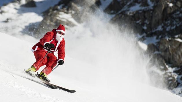 A man dressed as Santa Claus skis down the slope during a promotional event on the opening weekend in the alpine ski resort in Verbier. Around 1200 skiers dressed as Santa Claus were granted free access to the ski resort to celebrates the ski season's opening. (Jean-Christophe Bott/Keystone / AP) A man dressed as Santa Claus skis down the slope during a promotional event on the opening weekend in the alpine ski resort in Verbier. Around 1200 skiers dressed as Santa Claus were granted free access to the ski resort to celebrates the ski season's opening. (Jean-Christophe Bott/Keystone / AP)
