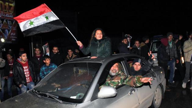 Syrians celebrate on December 22, 2016 in the northern Syrian city of Aleppo, after the army said it has retaken full control of the country's second city The army said it has retaken full control of Syria's devastated second city Aleppo, scoring its biggest victory against opposition forces since the civil war erupted in 2011.(AFP)