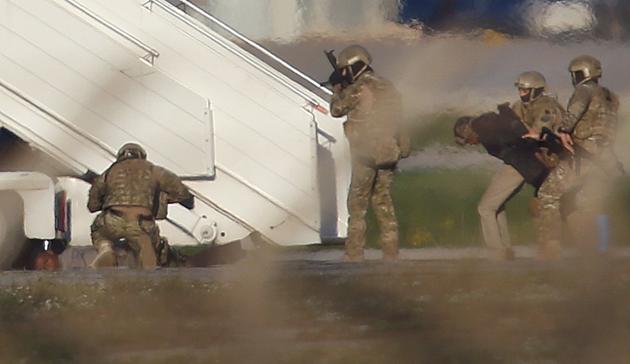 Two hijackers of a Libyan Afriqiyah Airways Airbus A320 surrender to Maltese military on the runway at Malta Airport. (REUTERS)