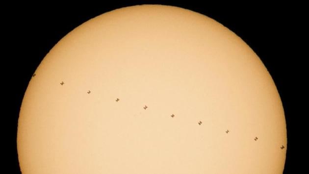 This Nasa composite image, made from ten frames, shows the International Space Station, with a crew of six on-board, in silhouette as it transits the sun at roughly five miles per second. (Joel Kowsky/Nasa/AFP Photo)