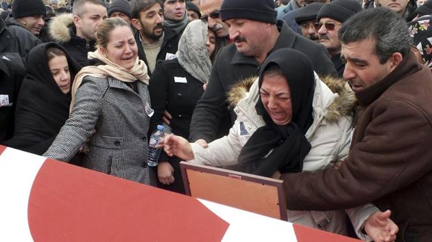 Family members weep in Cayiralan, Yozgat, Turkey, on Friday during funeral prayers for Turkish soldier Oktay Durak, who was killed with 15 others by IS militants in al-Bab, Syria. Turkey sent ground troops into northern Syria in August to support Syrian opposition forces in clearing a border area of IS militants and to prevent Syrian Kurds from making greater territorial advances.(AP) Family members weep in Cayiralan, Yozgat, Turkey, on Friday during funeral prayers for Turkish soldier Oktay Durak, who was killed with 15 others by IS militants in al-Bab, Syria. Turkey sent ground troops into northern Syria in August to support Syrian opposition forces in clearing a border area of IS militants and to prevent Syrian Kurds from making greater territorial advances.(AP)