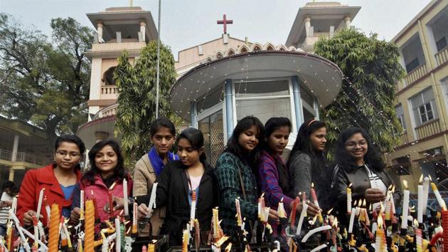 People light candles outside a Church on the occasion of Christmas in Patna. (PTI Photo) People light candles outside a Church on the occasion of Christmas in Patna. (PTI Photo)