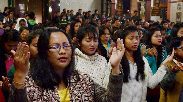 Devotees offer prayers at a church on the occasion of Christmas in Agartala, Tripura. (PTI Photo) Devotees offer prayers at a church on the occasion of Christmas in Agartala, Tripura. (PTI Photo)