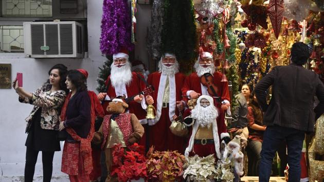 People visit Khan Market on Christmas eve to shop in New Delhi. (Saumya Khandelwal/HT Photo) People visit Khan Market on Christmas eve to shop in New Delhi. (Saumya Khandelwal/HT Photo)