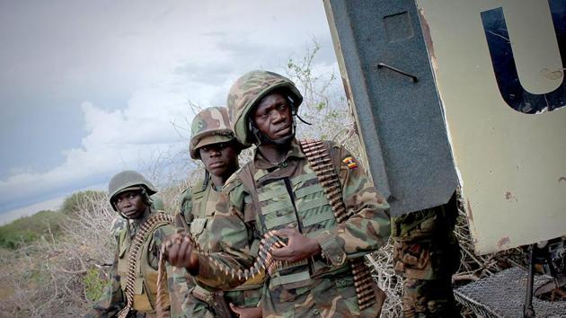 Soldiers with the African Union Mission in Somalia stand next to an armoured personnel carrier during an operation to seize and liberate territories from al Shabaab militants in Deyniile.(Reuters File) Soldiers with the African Union Mission in Somalia stand next to an armoured personnel carrier during an operation to seize and liberate territories from al Shabaab militants in Deyniile.(Reuters File)