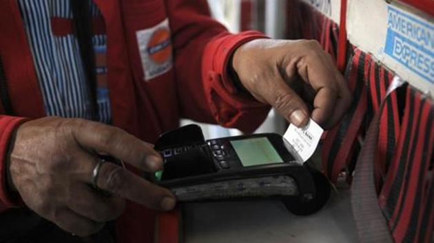 Noida, India - December 13, 2016: Vehicle owners use credit/debit card for payment of petrol after union government announced 0.75% discount on digital transactions over public petrol pumps, in Noida, India, on Tuesday, December 13, 2016. (Photo by Sunil Ghosh / Hindustan Times) Noida, India - December 13, 2016: Vehicle owners use credit/debit card for payment of petrol after union government announced 0.75% discount on digital transactions over public petrol pumps, in Noida, India, on Tuesday, December 13, 2016. (Photo by Sunil Ghosh / Hindustan Times)