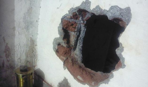 The hole that the thieves dug to steal the jewellery. (HT Photo) The hole that the thieves dug to steal the jewellery. (HT Photo)