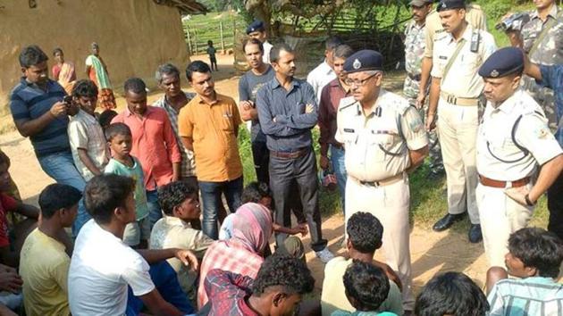 In this photo from August 2016, police talk to residents of Kanja village in Jharkhand after five women were killed over accusations of practising witchcraft. Crimes against women in the state have been increasing, with rape or being labelled a witch being the major reasons.(AFP file)