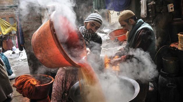 A man pours hot, coloured water into another vessel while dyeing threads. The dyeing industry is boosted by the Valley’s handicraft industry, as the colourful threads are used in designing of products like woollen shawls, carpets and Pashmina products. (Waseem Andrabi/HT Photo)
