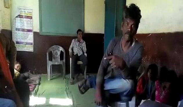 Mahendra Singh, the alleged alcoholic teacher at Government Primary School in Ghungri Village, Betul. (Videograb) Mahendra Singh, the alleged alcoholic teacher at Government Primary School in Ghungri Village, Betul. (Videograb)